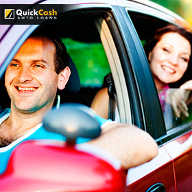 Happy Family Driving Their Car After Receiving An Auto Title Loan