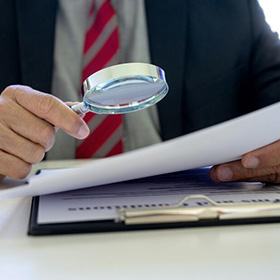 A Person Holding a Magnifying Glass