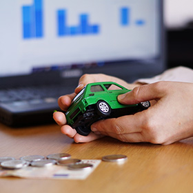 A Person Holding a Toy Car